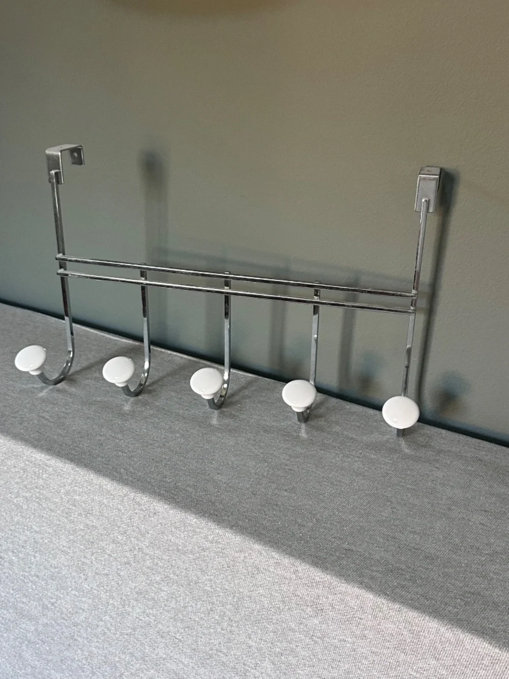Container Store: Chrome 5-Hook Over-the-Door Rack with White Ceramic Knobs